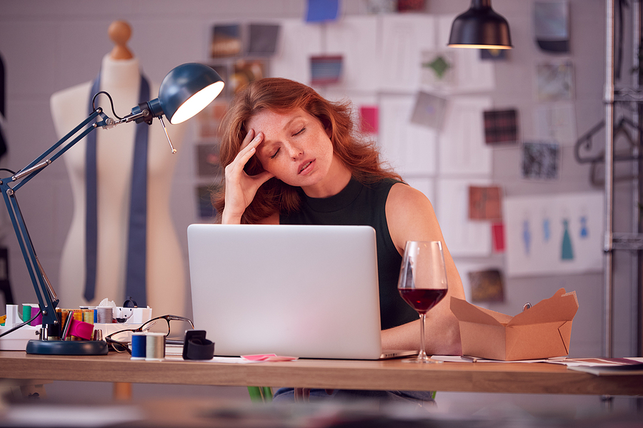 Worried female business owner at computer